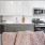 a kitchen with white cabinets
