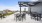 a group of tables and chairs on a deck