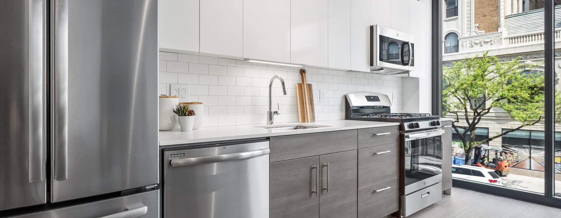 a kitchen with white cabinets